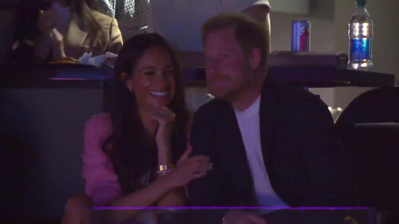 Meghan Markle and Prince Harry giggle and pull faces at Lakers basketball game after coronation snub