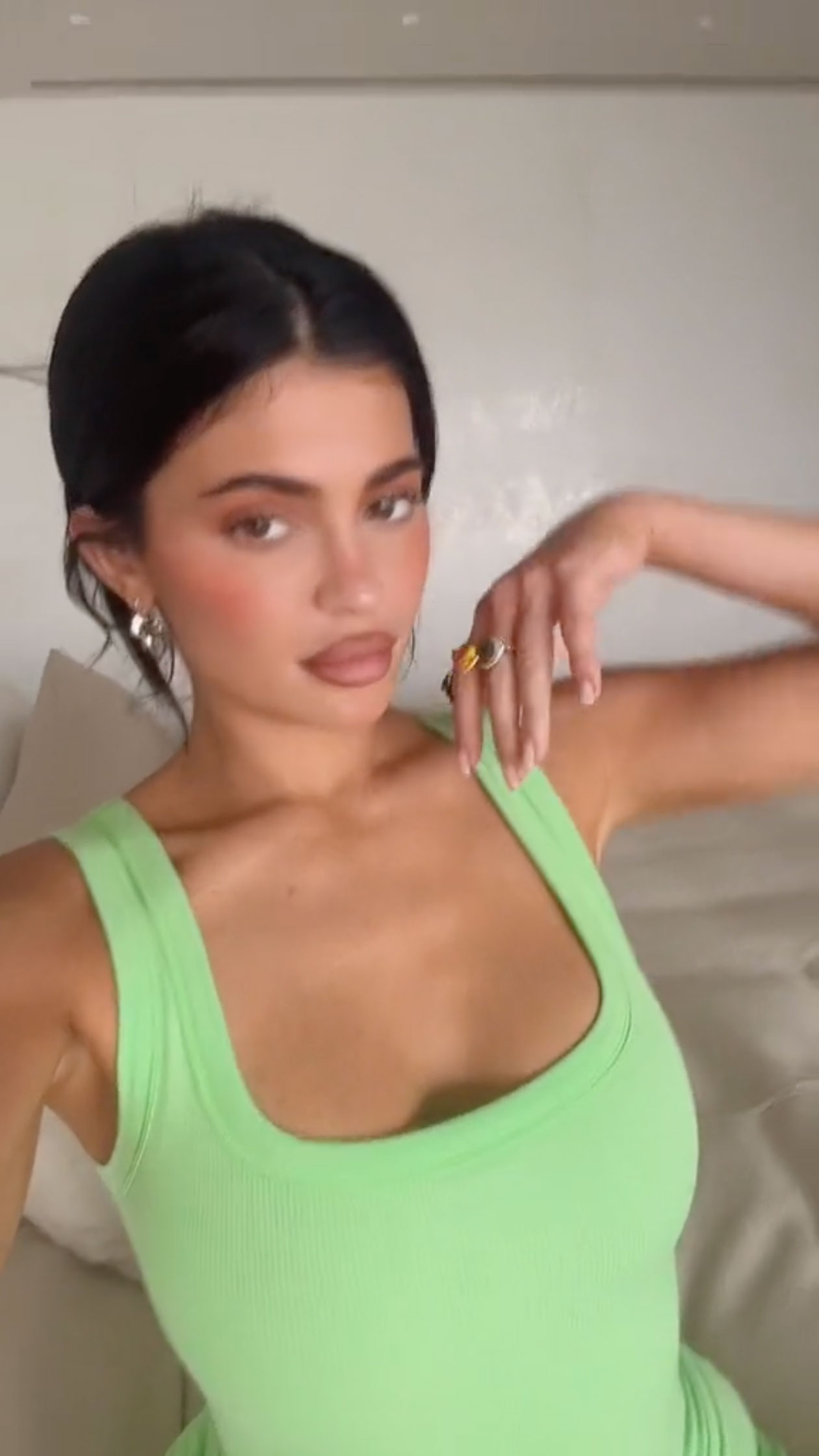 Kylie Jenner spills out of tiny sports bra and shows off her thin waist in skintight spandex shorts for new photos