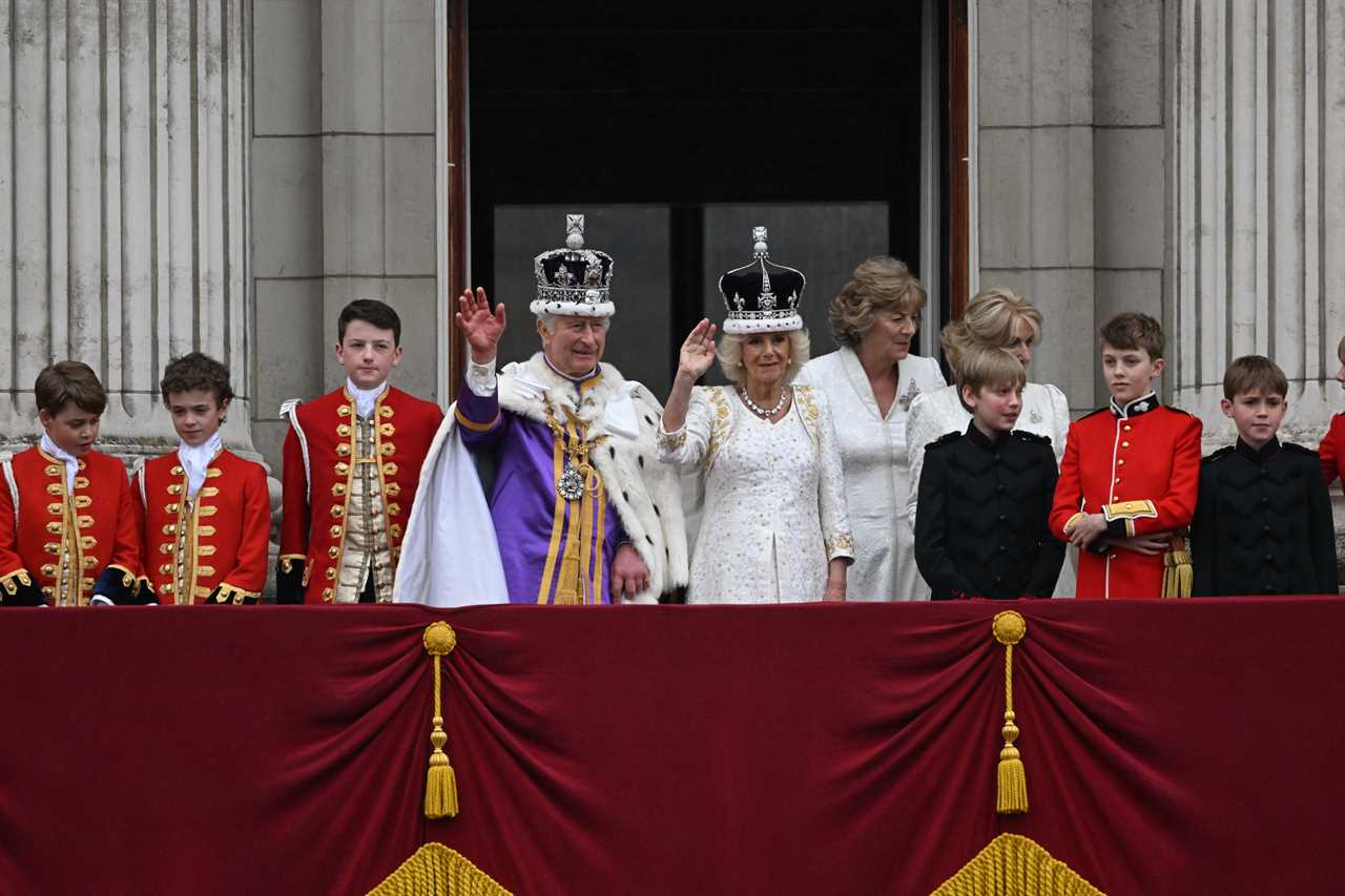 Prince Harry grins at Heathrow before jetting to LA just an hour after coronation as his family wave on Palace balcony