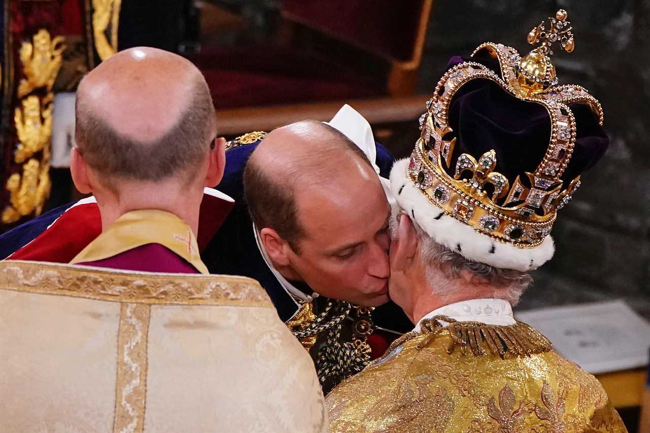 Prince William seals dad King Charles’ coronation with a kiss as he vows loyalty to his father