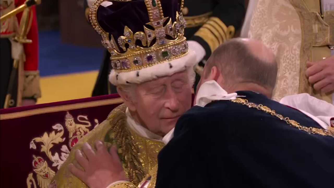 Prince William seals dad King Charles’ coronation with a kiss as he vows loyalty to his father