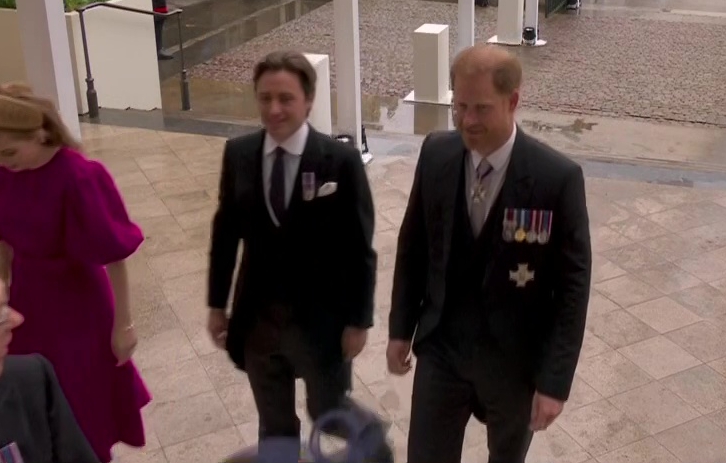 Prince Harry smiles despite sitting in third row after arriving separately from brother William at dad’s coronation