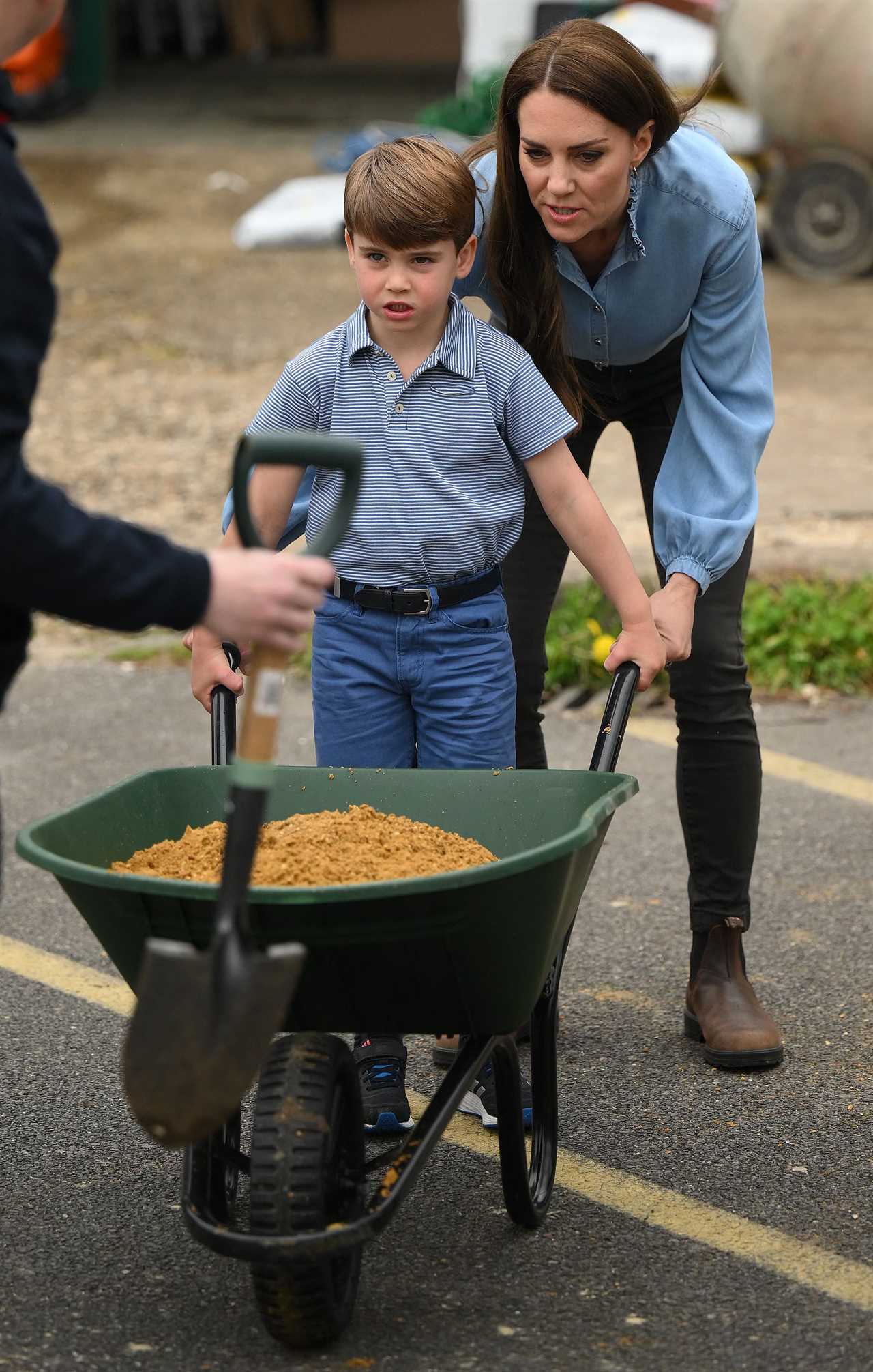 Hardworking Prince Louis rides digger and fills wheelbarrow as Charlotte paints fence on visit with William and Kate