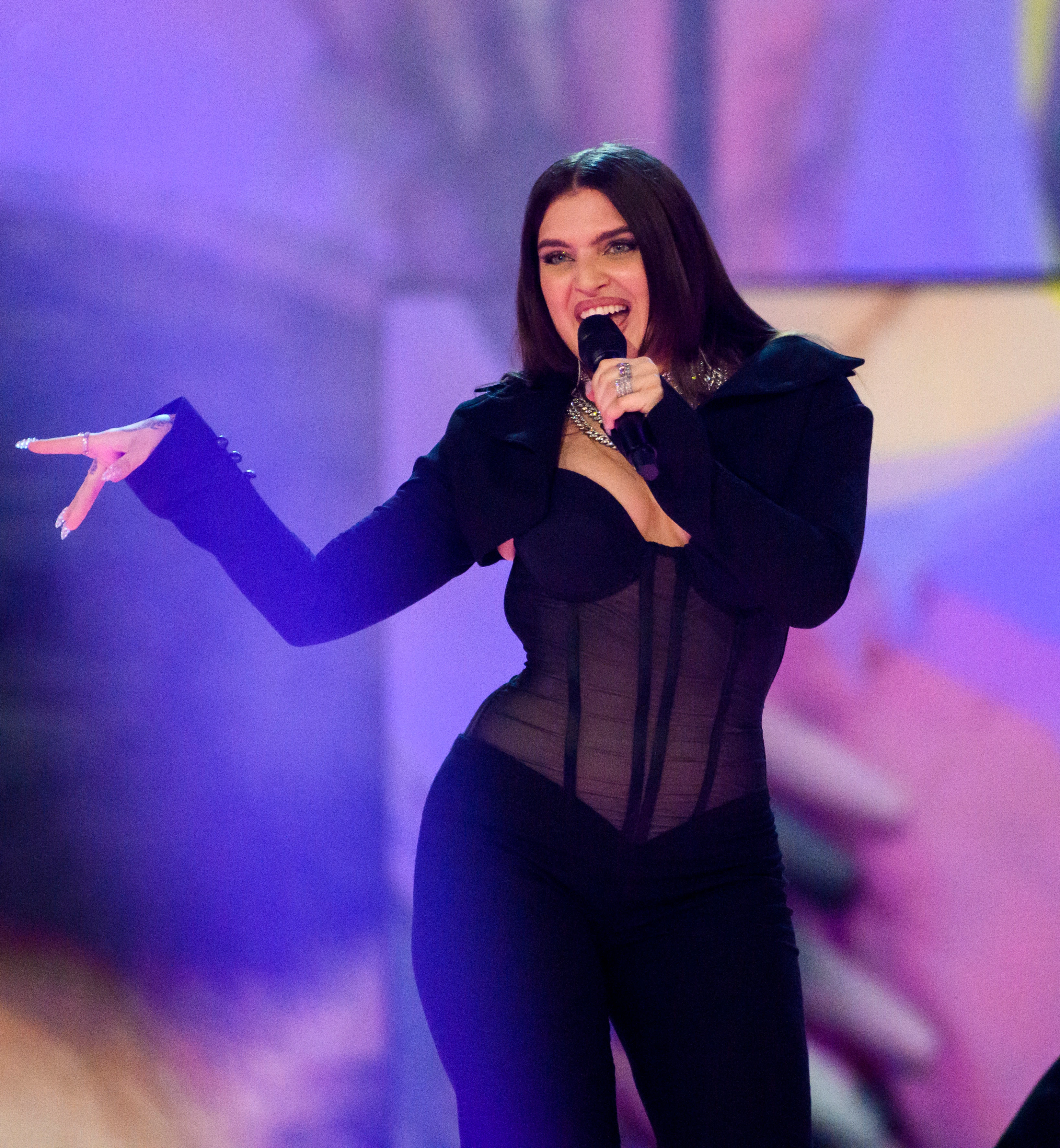 Mae Muller sends Eurovision into chaos in see-through corset as crowd drowns out hosts
