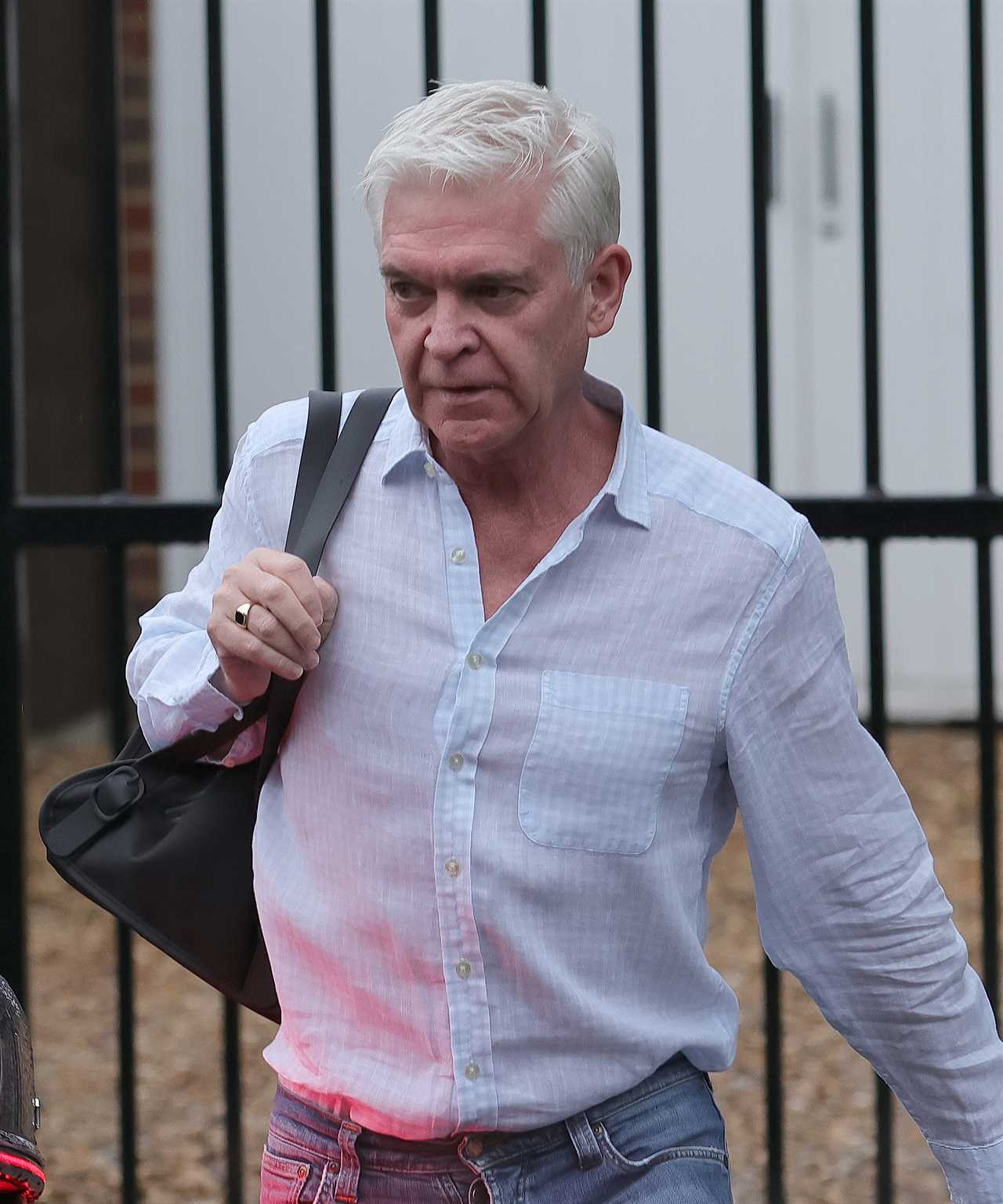 Phillip Schofield leaves home to head to work on This Morning after taking legal action over Holly Willoughby fallout