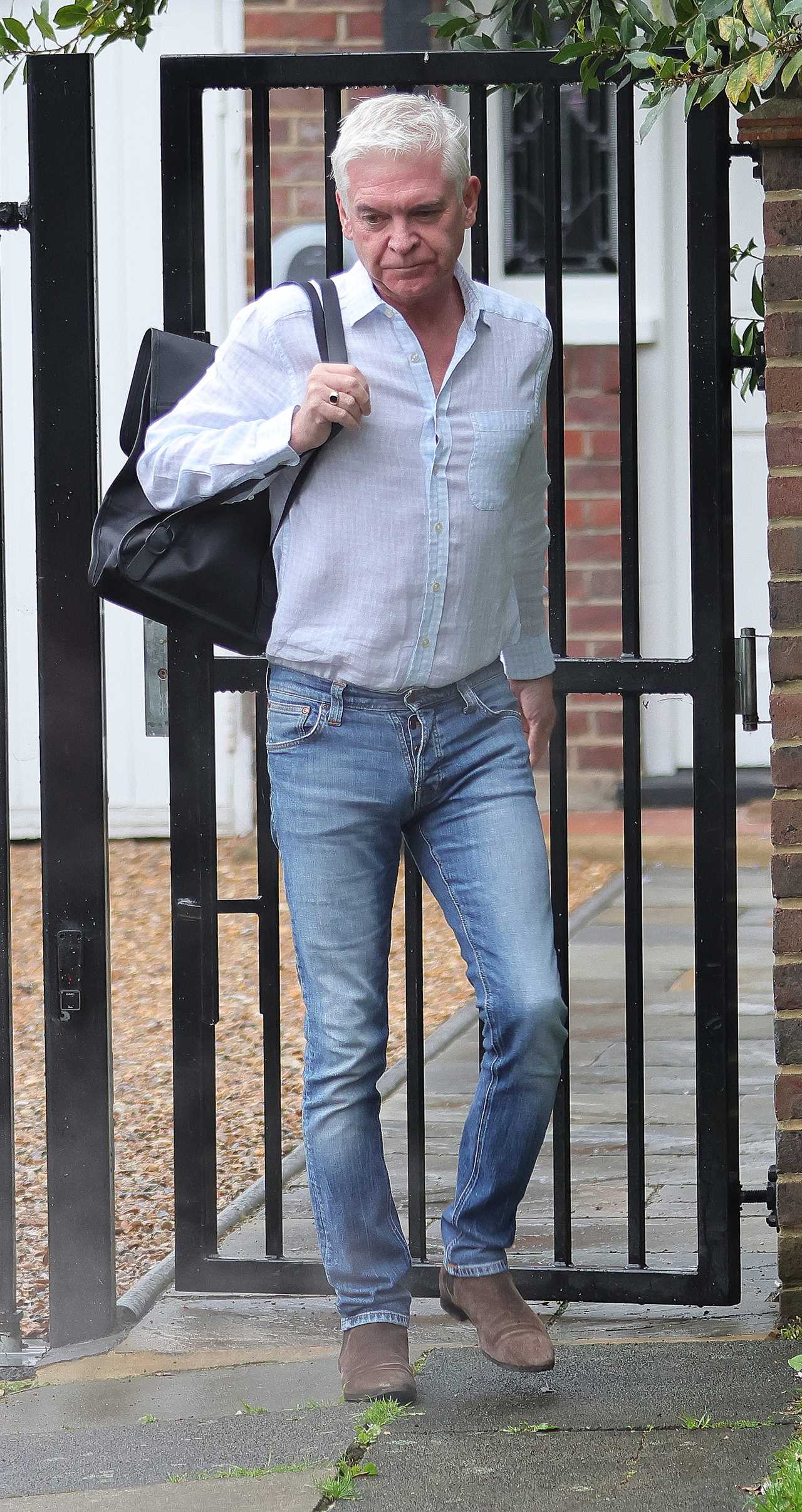 Phillip Schofield leaves home to head to work on This Morning after taking legal action over Holly Willoughby fallout