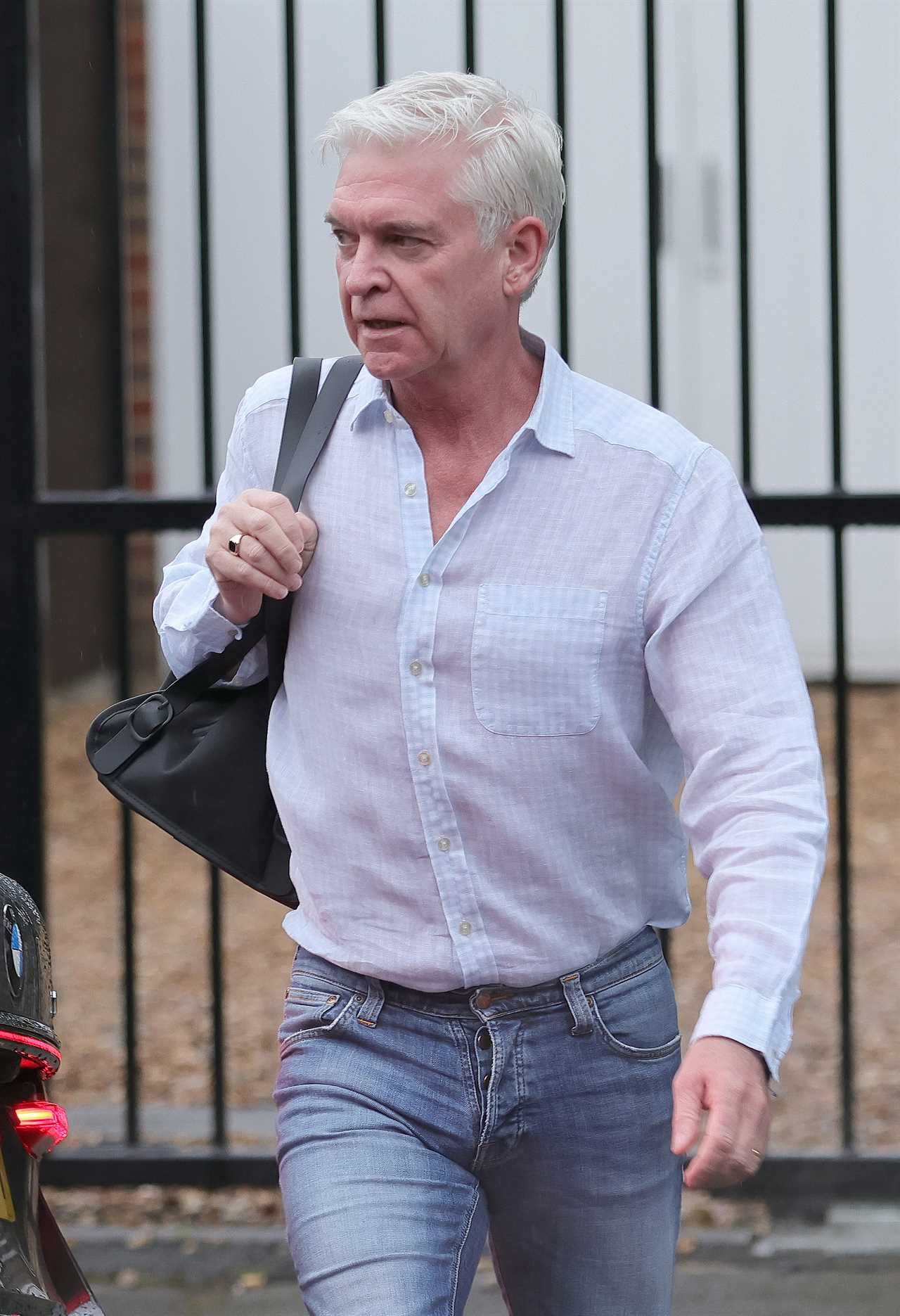 Phillip Schofield leaves home to head to work on This Morning after taking legal action over Holly Willoughby fallout