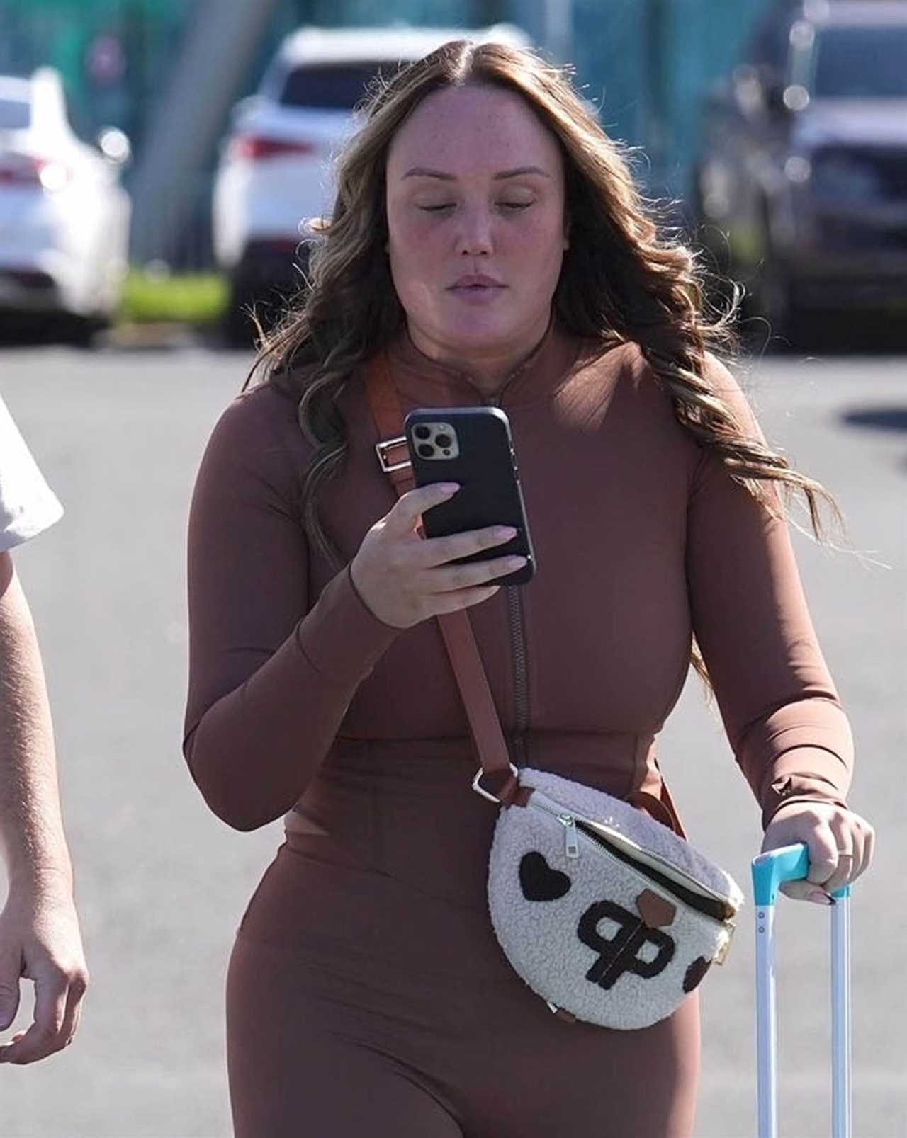 Makeup-free Charlotte Crosby snogs boyfriend Jake Ankers before they jet off to Ibiza