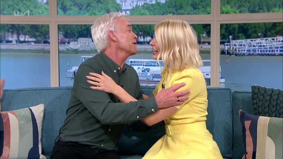 Holly Willoughby puts Phillip Schofield feud behind her as she laughs with King Charles after leaving This Morning early