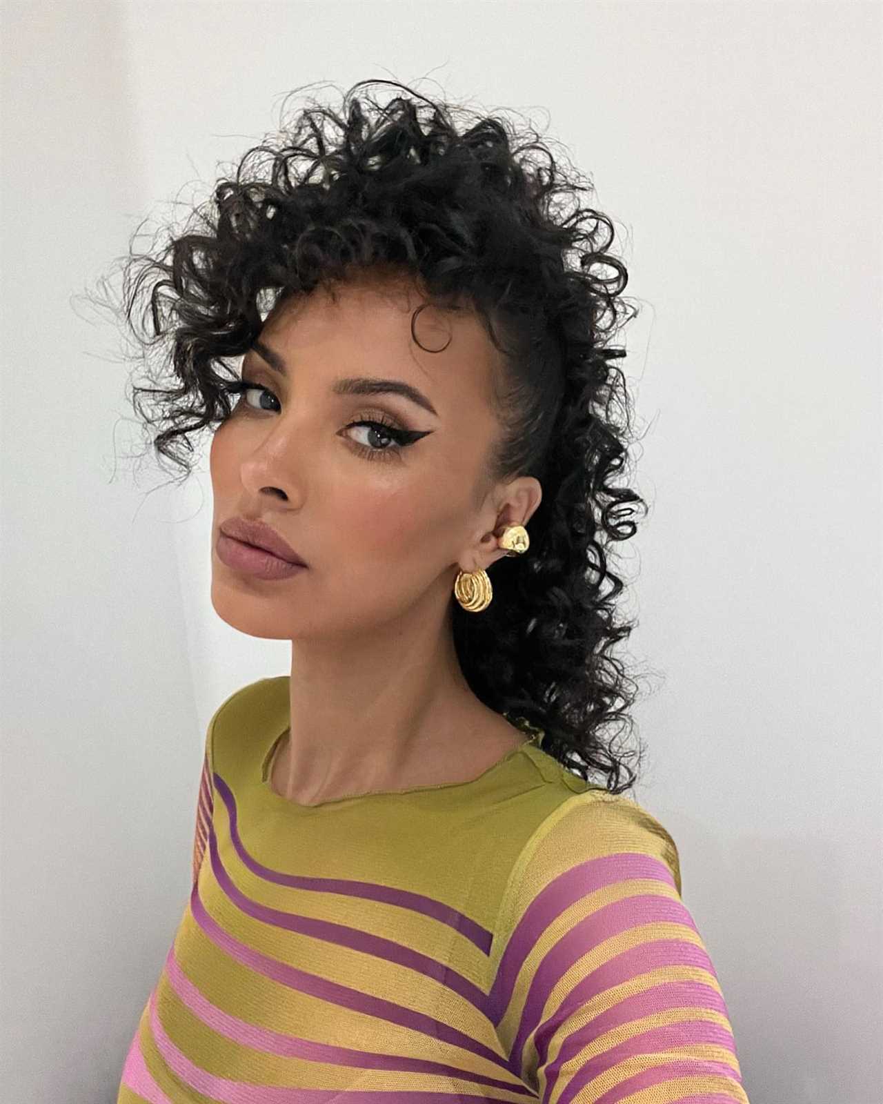 Love Island’s Maya Jama looks worlds away from the villa with a curly mullet as she shows off hair transformation