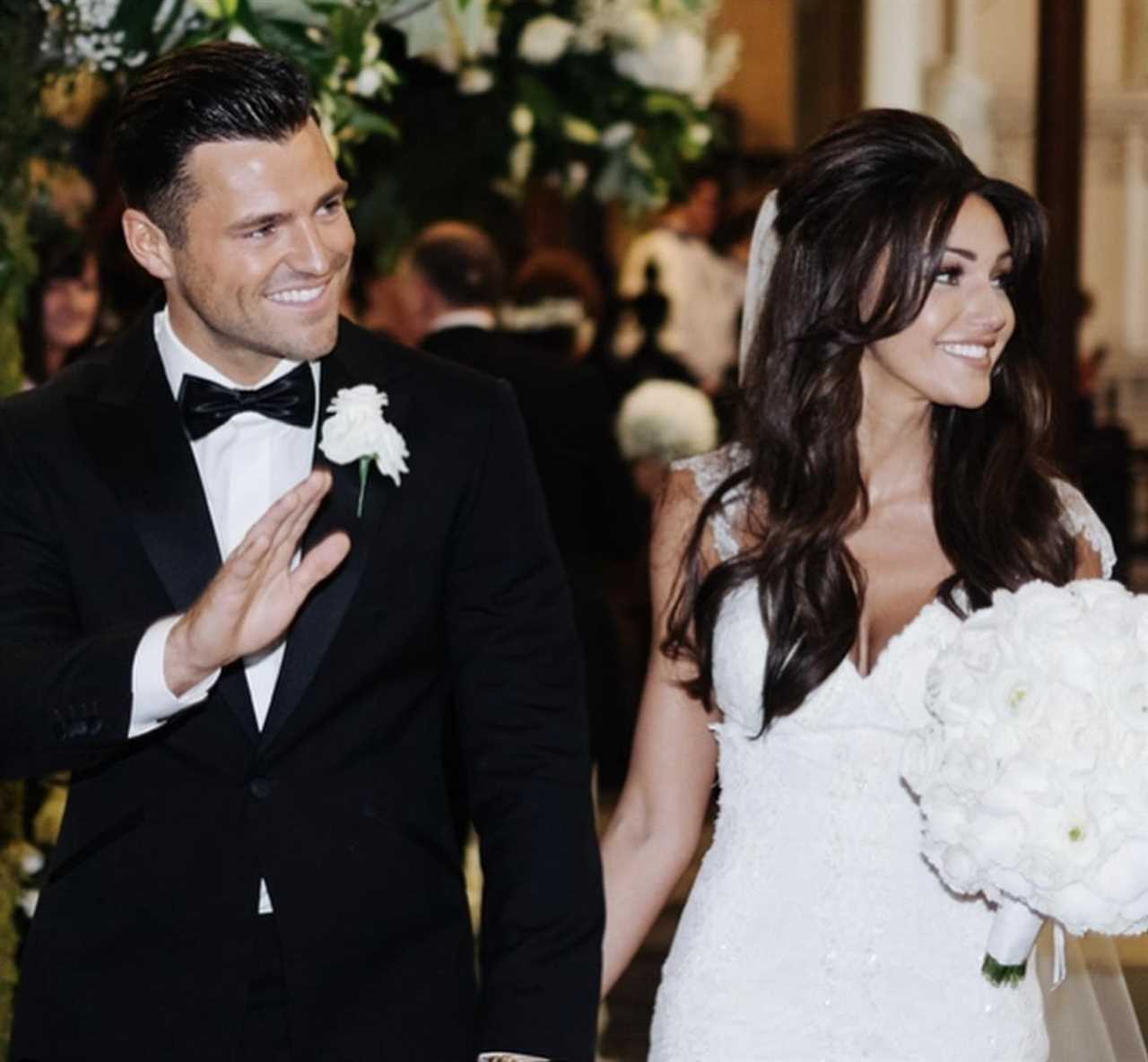 Michelle Keegan and Mark Wright toast their wedding anniversary as they pose at VERY famous hotel