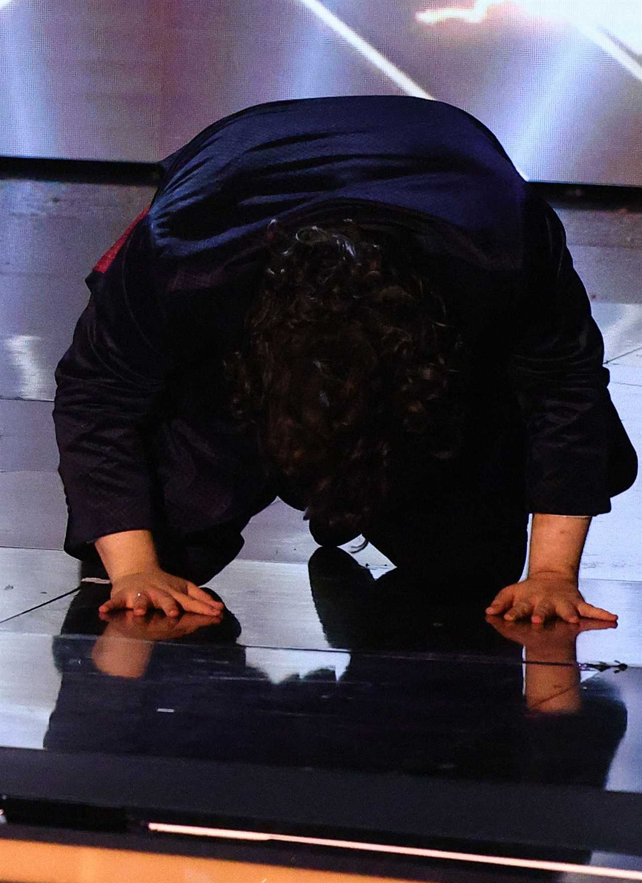 Emotional Travis George falls to the floor on BGT after admitting personal struggle left him in a ‘bad place’