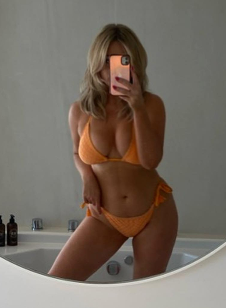 Emily Atack shows off incredible figure in barely-there orange bikini during Ibiza holiday