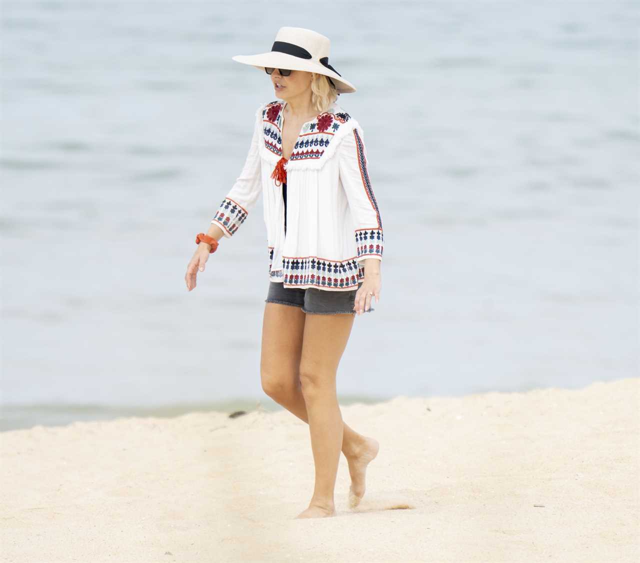 Exclusive pictures of Holly Willoughby on her holiday in Portugal. .Holly pictured on the Beach with her family. ...Pictures by Dan Charity .01-06-23...