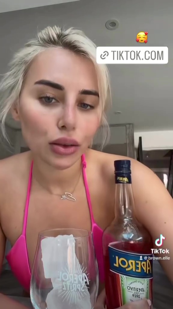 Love Island’s Ellie Brown leaves little to the imagination in barley there bikini as she films herself making a cocktail