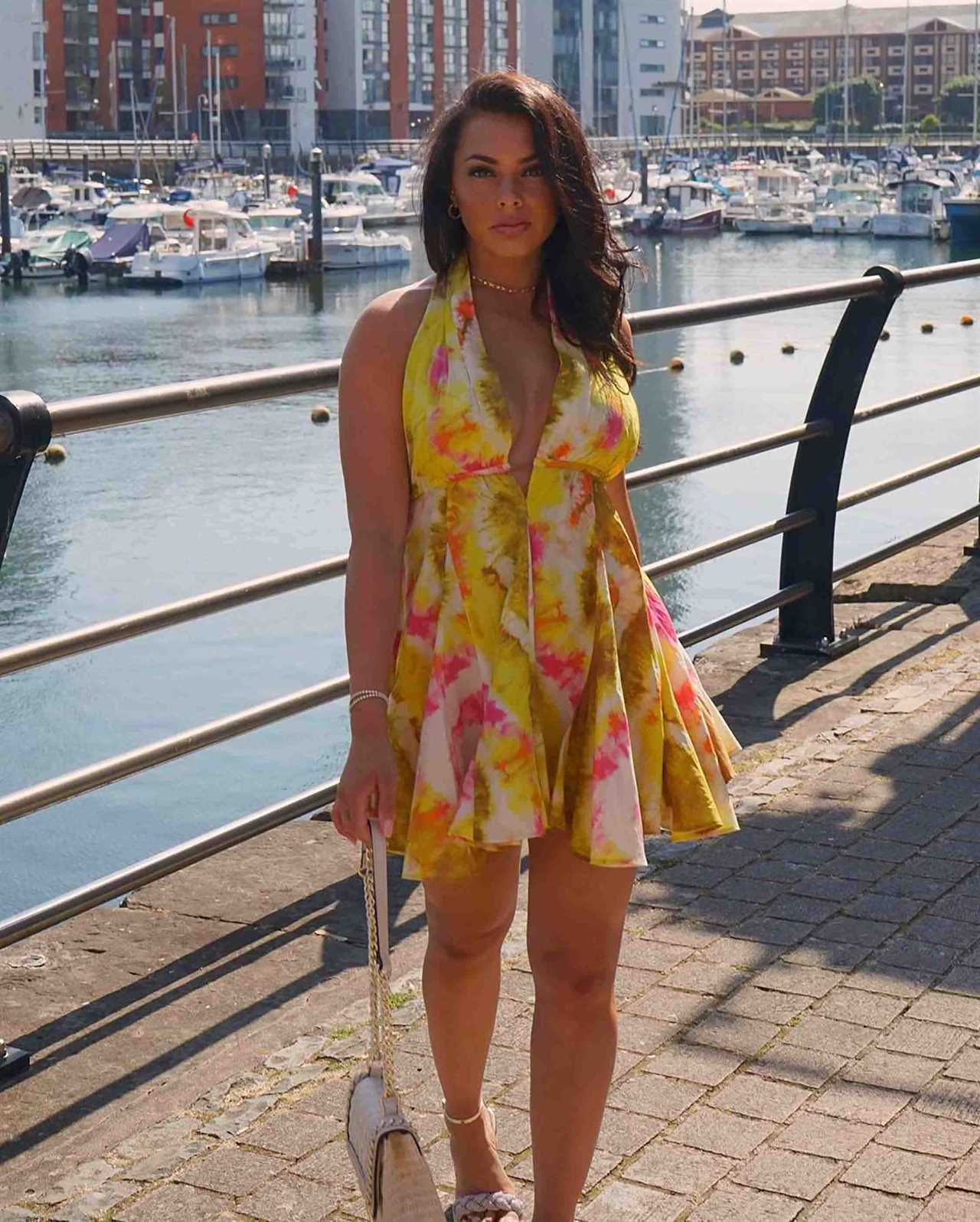 Love Island star Paige Thorne goes braless in plunging summer dress as she enjoys the sun in Cardiff