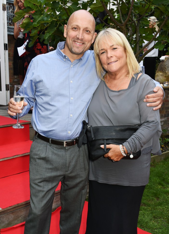 LONDON, ENGLAND - SEPTEMBER 04:  Mark Dunford (L) and Linda Robson attend Kelly Simpkin London's fashion soiree garden party in support of the British Red Cross at the home of Kelly Simpkin and Nicky Clarke on September 4, 2015 in London, England.  (Photo by David M. Benett/Dave Benett/Getty Images)