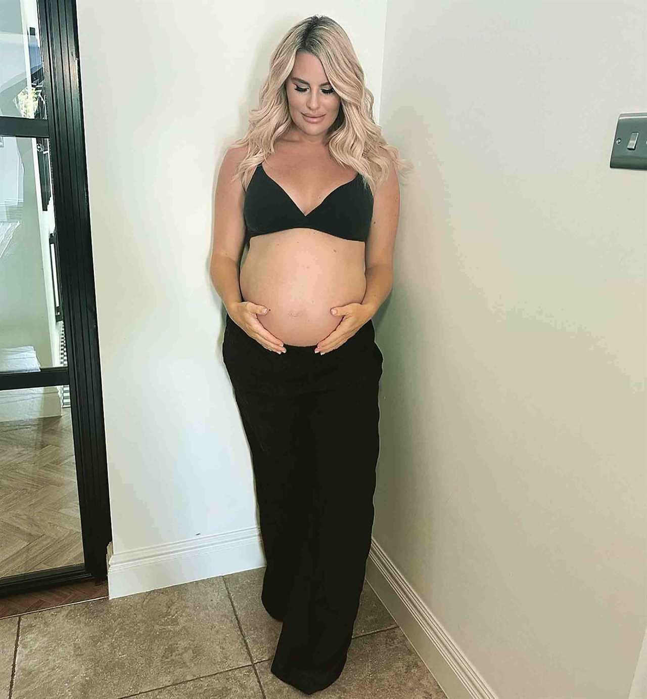 Towie’s Danielle Armstrong shows off her huge baby bump as she poses in a bra