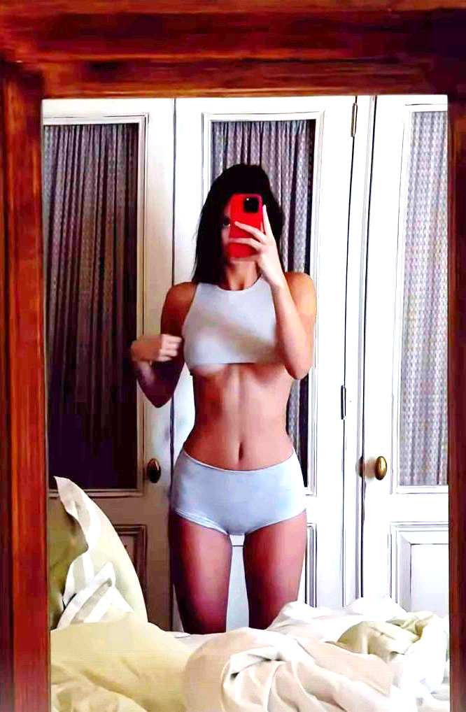 Kendall Jenner gives fans a peek at her underboob in very tiny bra top in new selfie video after boob job accusations