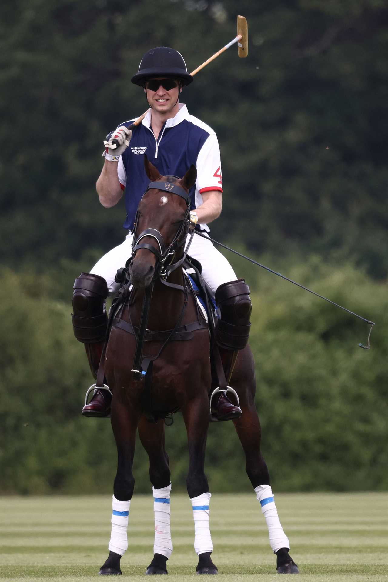 Princess Kate and Prince William look loved up as she cheers him on at charity polo match