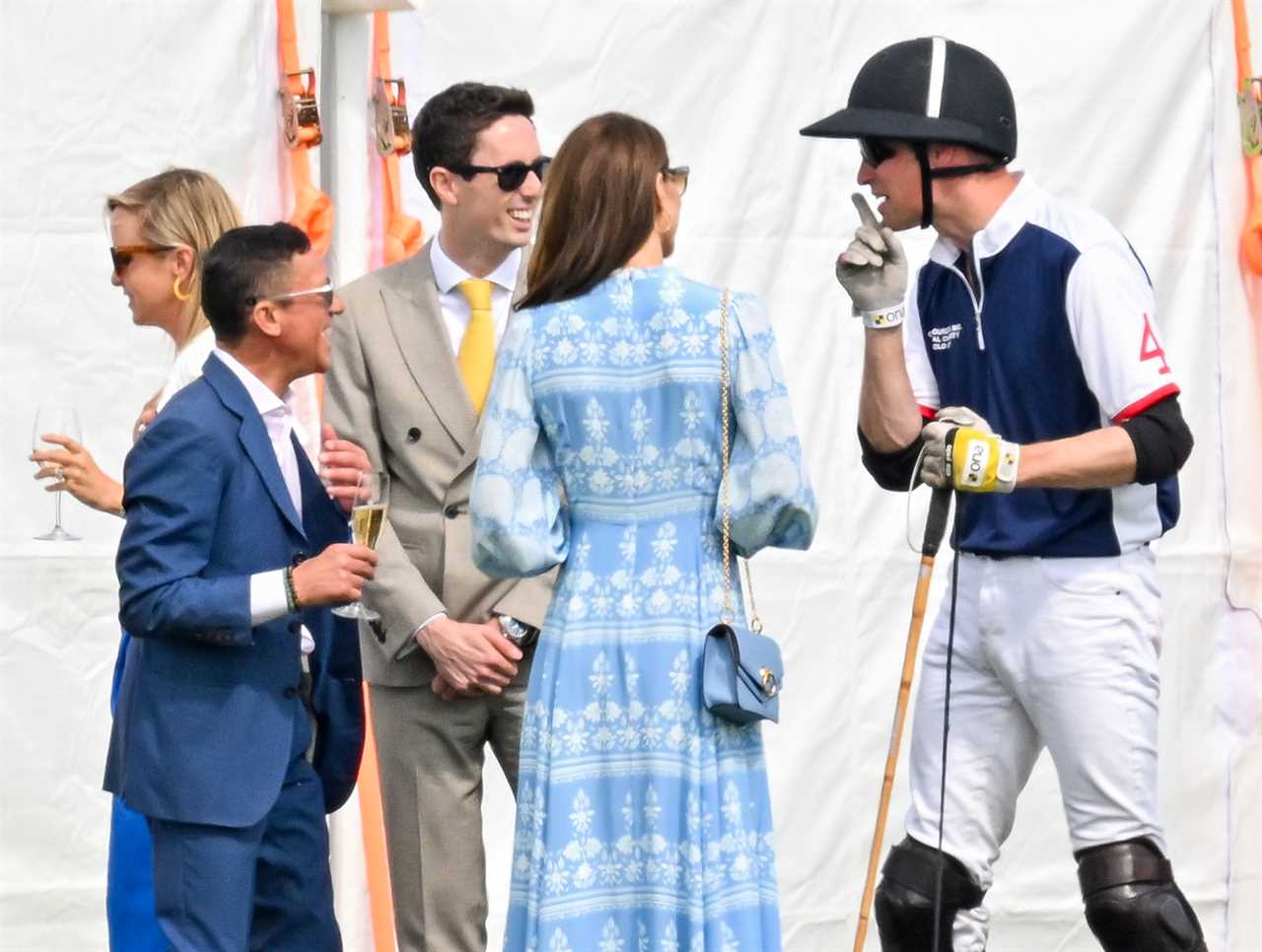 Princess Kate and Prince William look loved up as she cheers him on at charity polo match