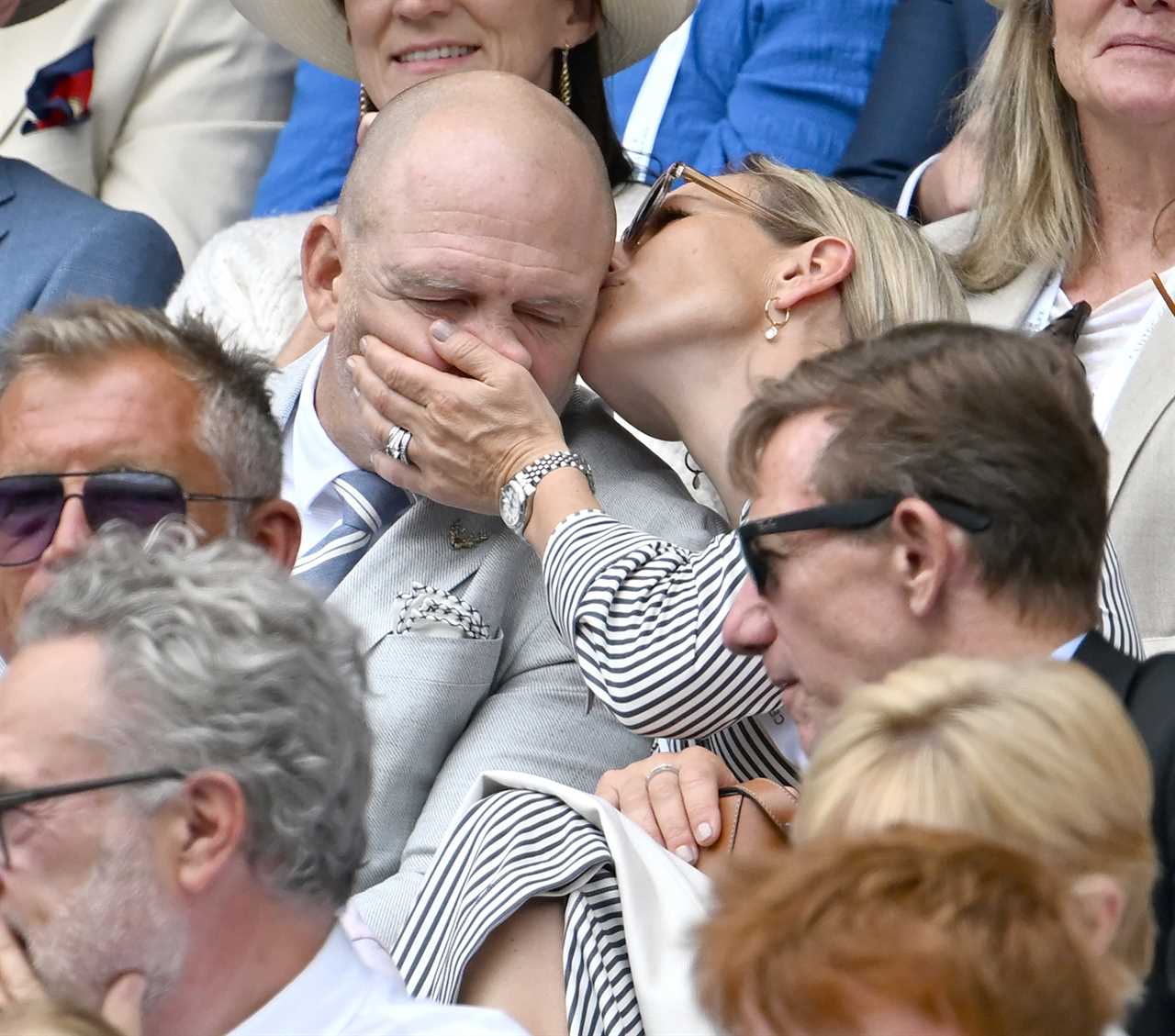 Zara and Mike Tindall share cheeky kiss as they put on a VERY cosy display at Wimbledon