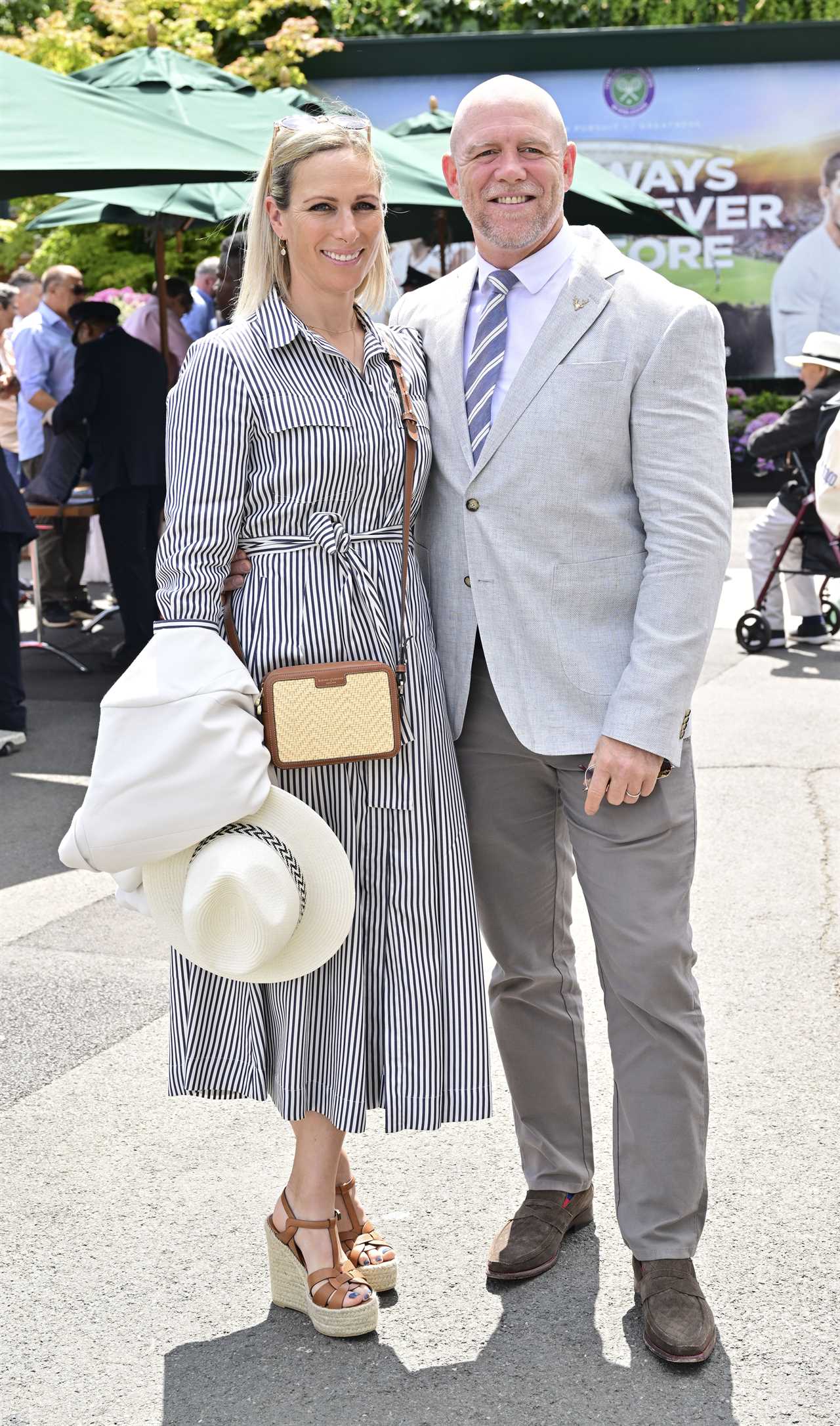 Zara and Mike Tindall share cheeky kiss as they put on a VERY cosy display at Wimbledon