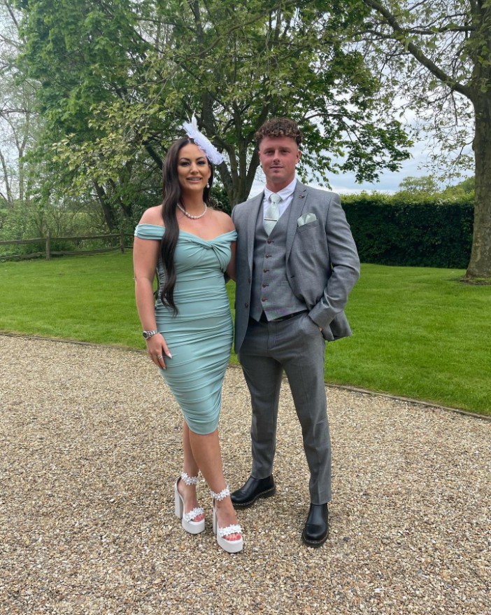 Married at First Sight contestant Jess Potter in a green dress standing with her boyfriend TJ