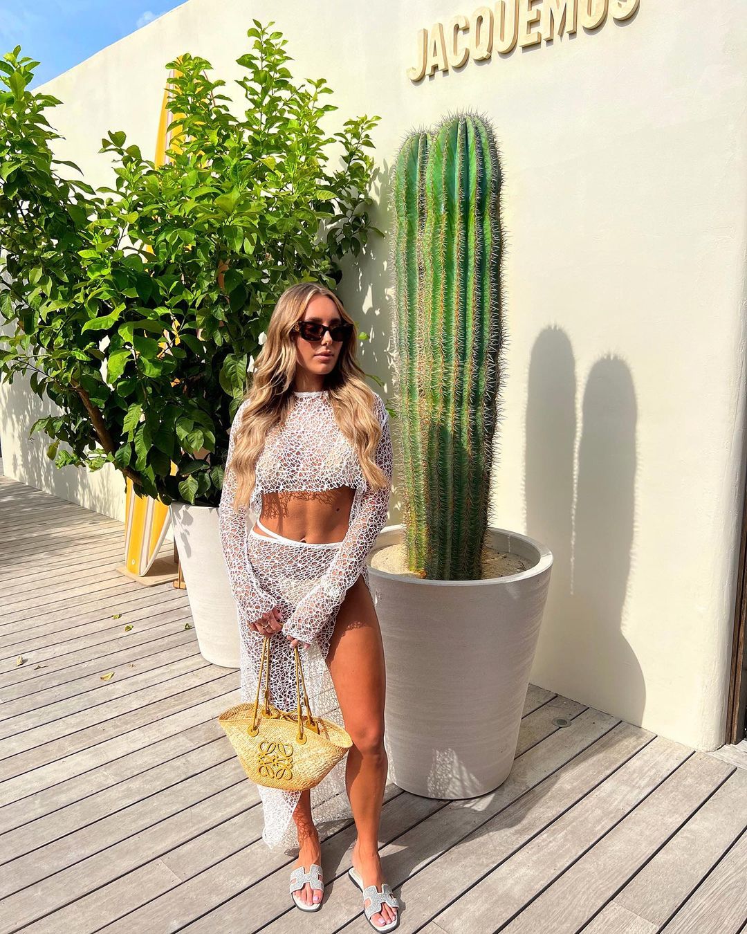 Towie’s Amber Turner reveals impressive abs as she poses in see-through beach outfit