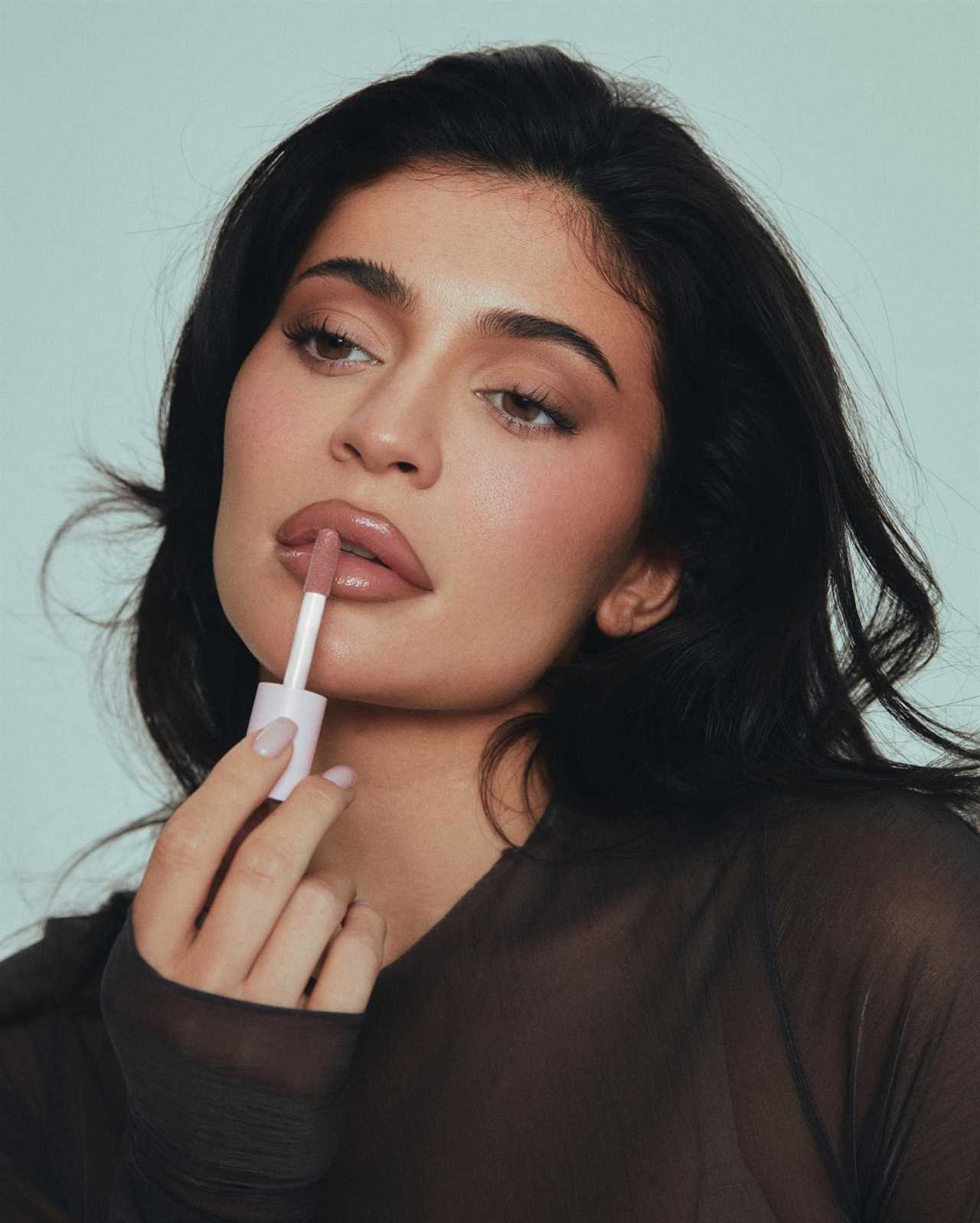 Kylie Jenner spills out of nude bra underneath racy see-through dress for rare-behind-the-scenes glimpse of makeup shoot