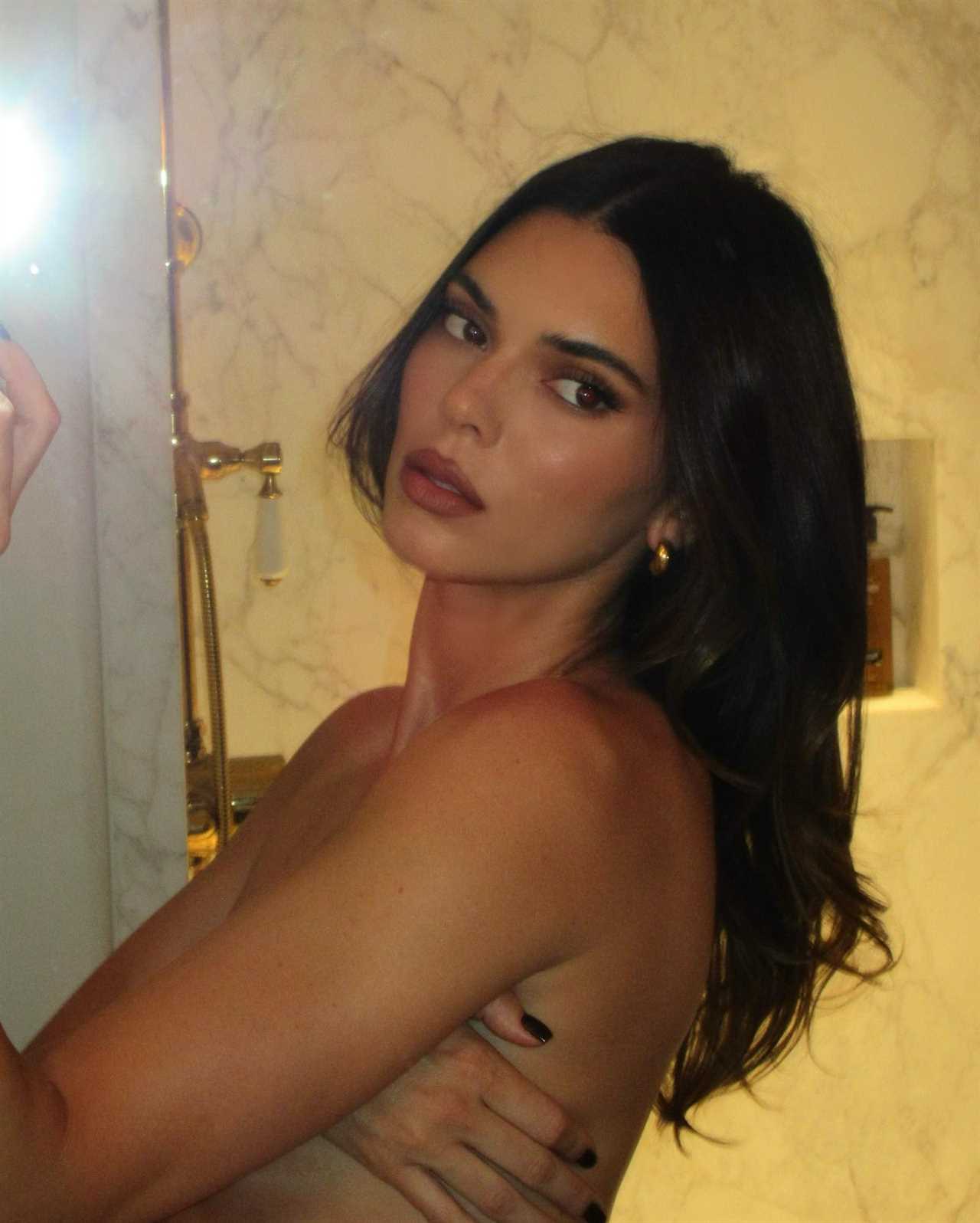 Kendall Jenner shows off underboob in super-short bra top and grey underwear after fans suspect she got plastic surgery