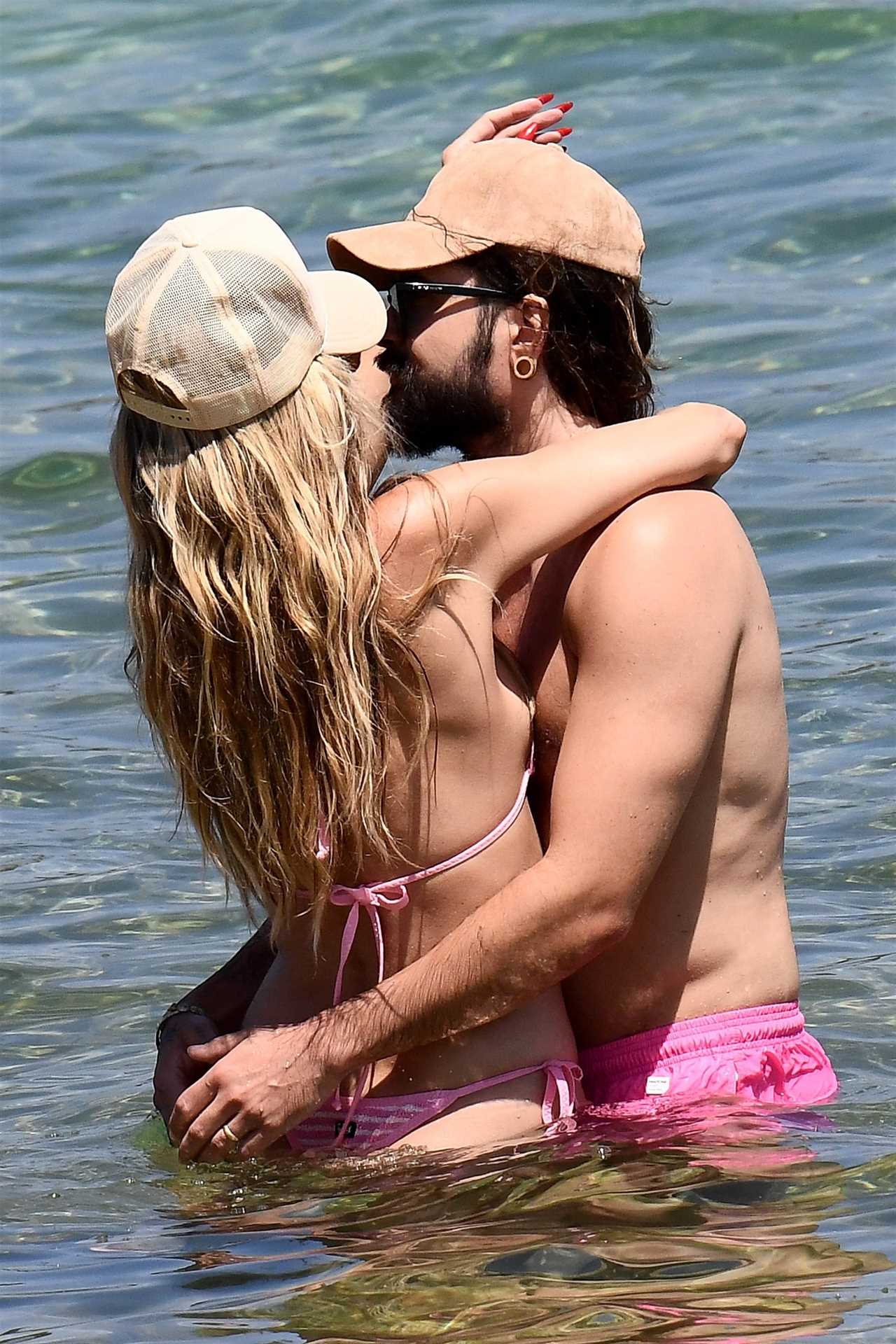 AGT’s Heidi Klum flaunts figure in thong bikini as star grabs husband Tom Kaulitz’s butt during steamy makeout session