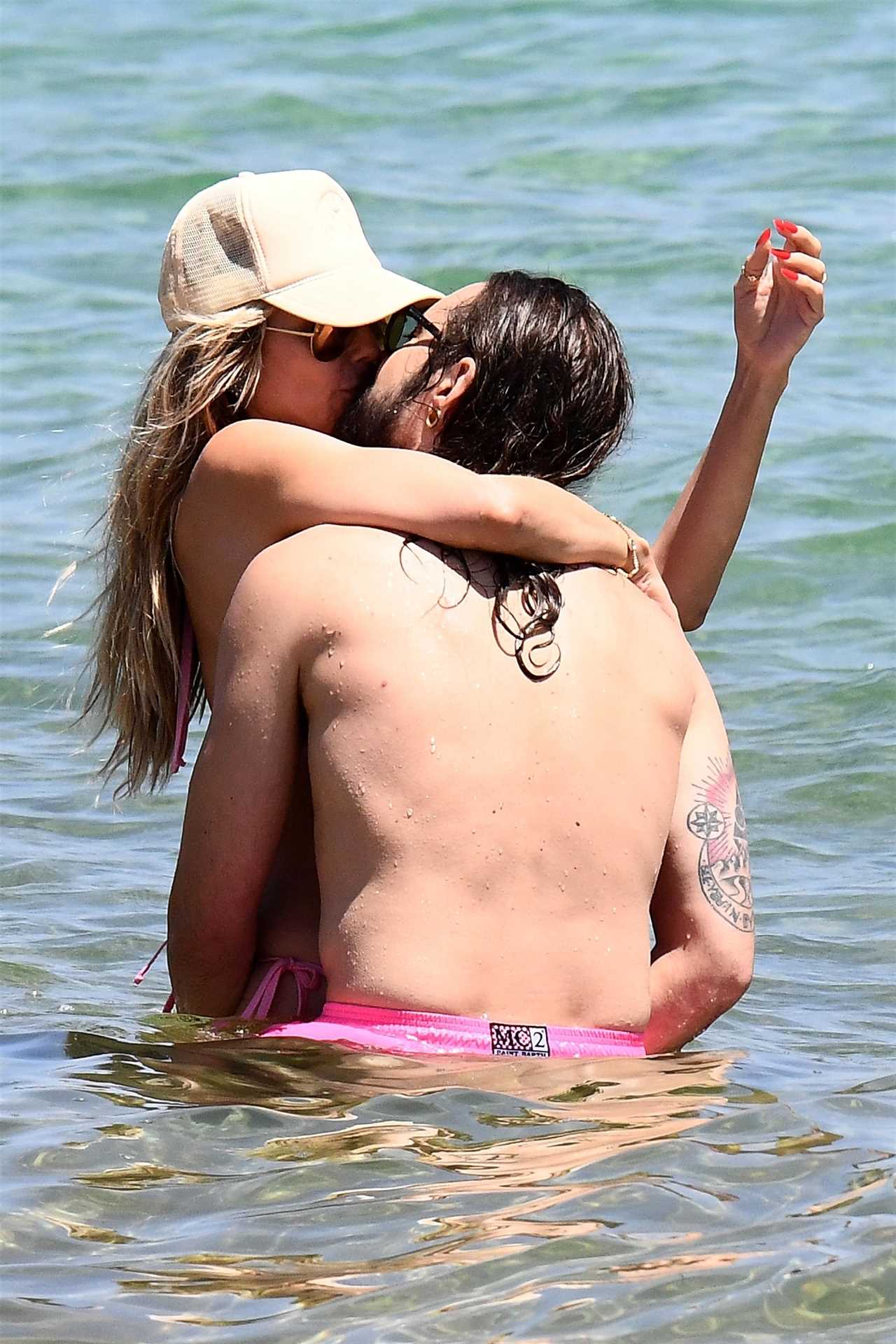 AGT’s Heidi Klum flaunts figure in thong bikini as star grabs husband Tom Kaulitz’s butt during steamy makeout session