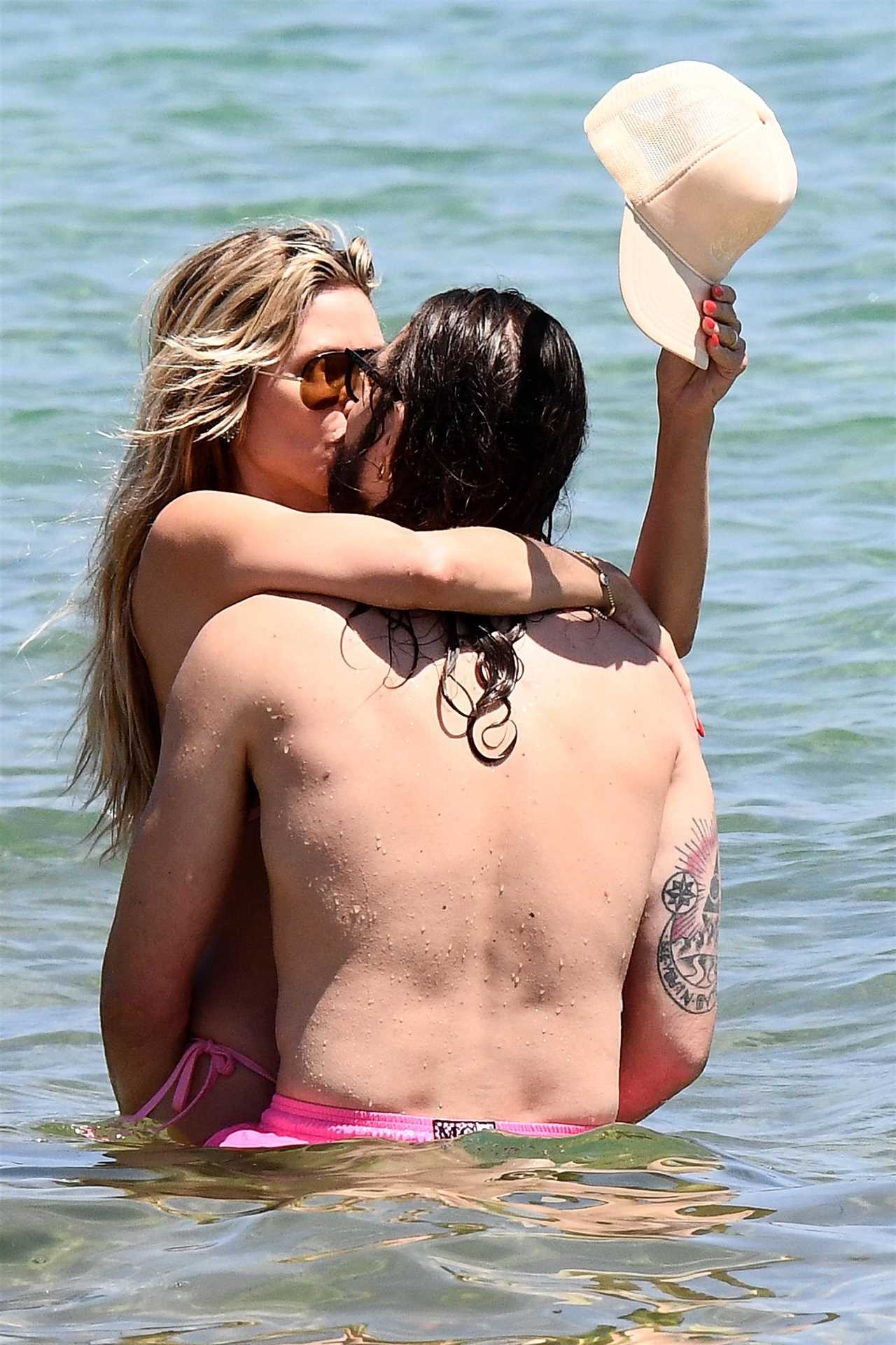 AGT’s Heidi Klum flaunts figure in thong bikini as star grabs husband Tom Kaulitz’s butt during steamy makeout session