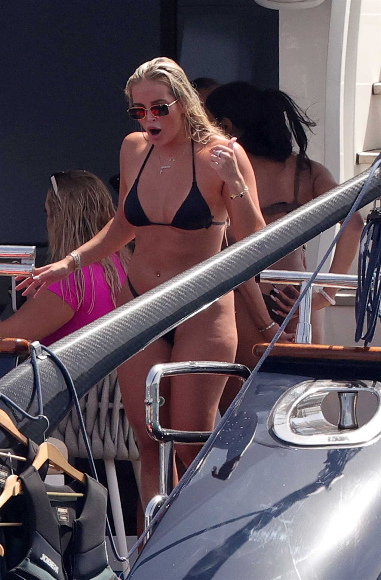 Love Island’s Mary Bedford flashes her bum in barely there thong bikini as she jumps off a yacht