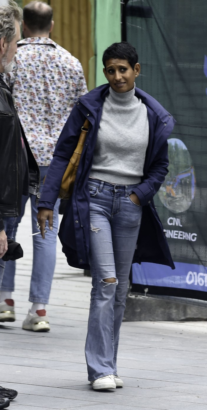 EXCLUSIVE: BBC Breakfast Presenter Naga Munchetty looks a picture of health after recent hospital dash. She is spotted chatting to friends in Manchester city centre whilst smoking a cigarette. Pictured: Naga Munchetty Ref: SPL9520429 270723 EXCLUSIVE Picture by: Aaron Parfitt / SplashNews.com Splash News and Pictures USA: 310-525-5808 UK: 020 8126 1009 eamteam@shutterstock.com World Rights