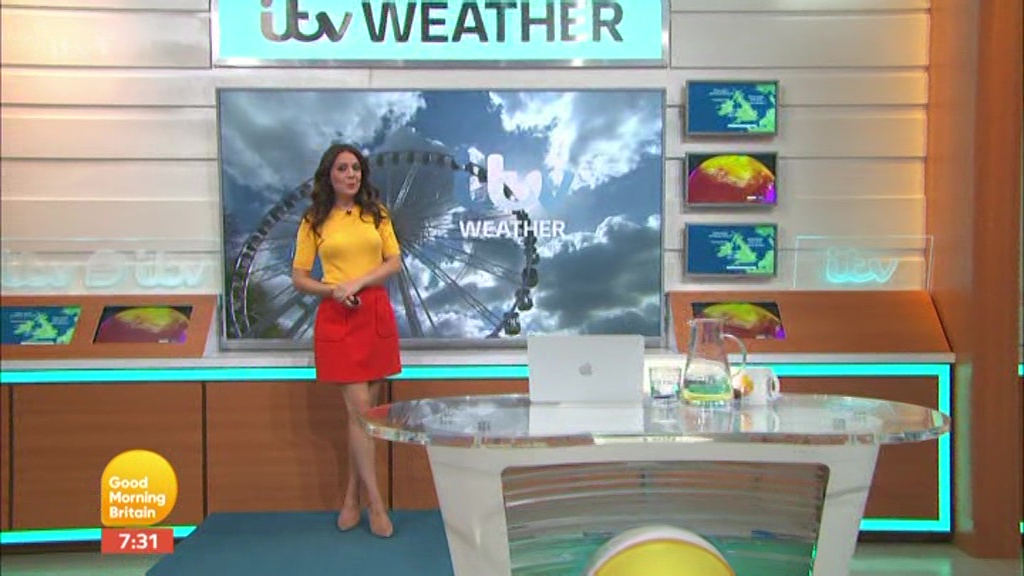 Good Morning Britain’s Laura Tobin flashes her toned legs in red mini skirt and heels