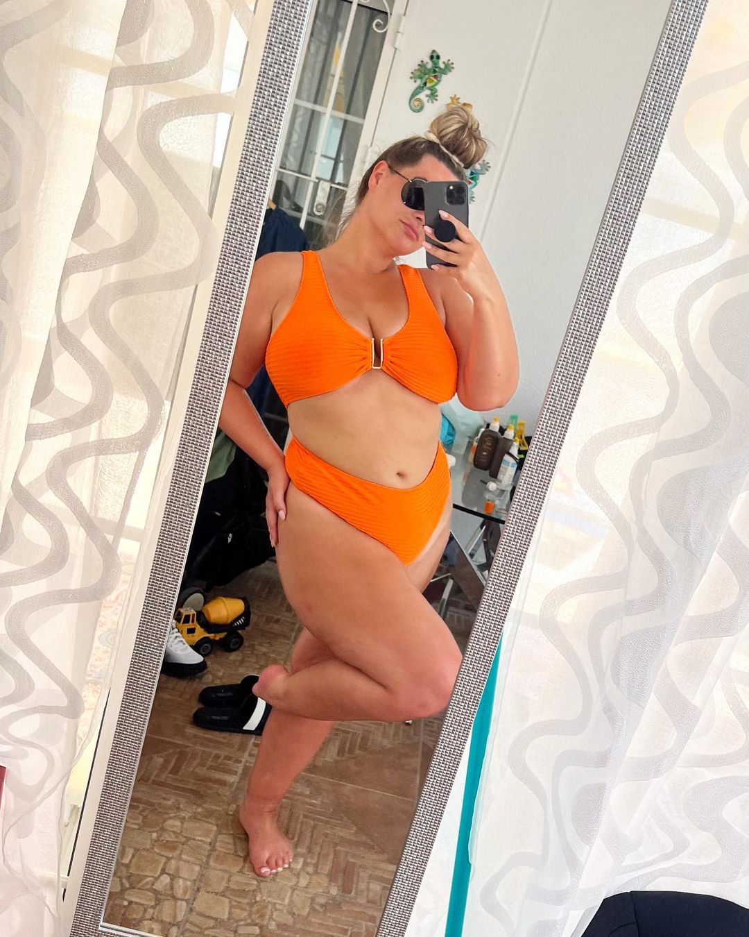 Love Island’s Shaughna Phillips shows off her curves in orange bikini three months after giving birth