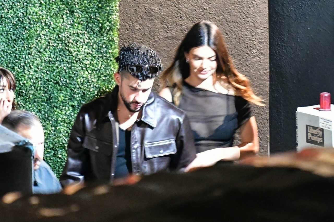 Kendall Jenner flashes lace bra in see-through top as she gets cozy with Bad Bunny on date night amid boob job rumors