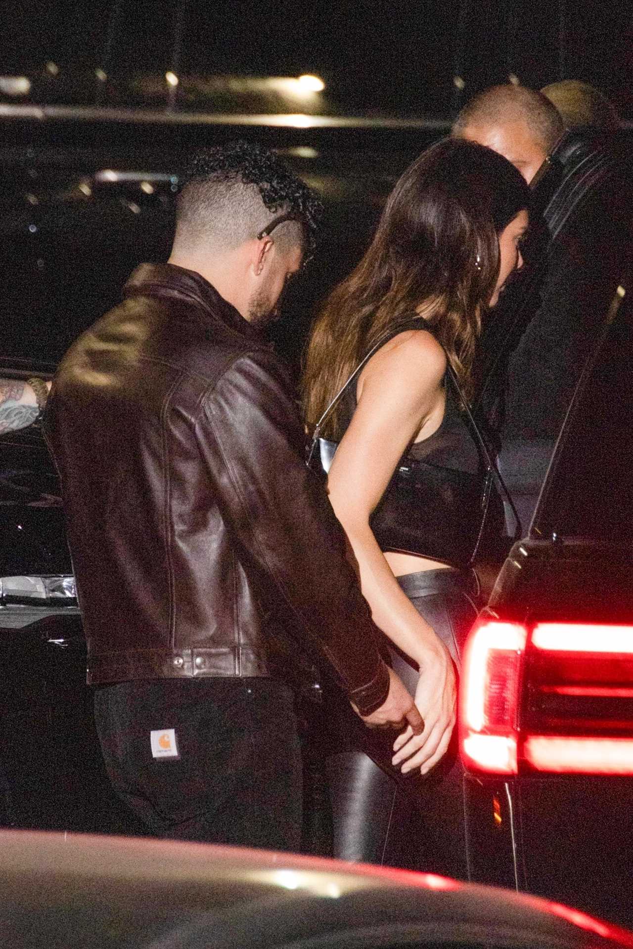Kendall Jenner flashes lace bra in see-through top as she gets cozy with Bad Bunny on date night amid boob job rumors