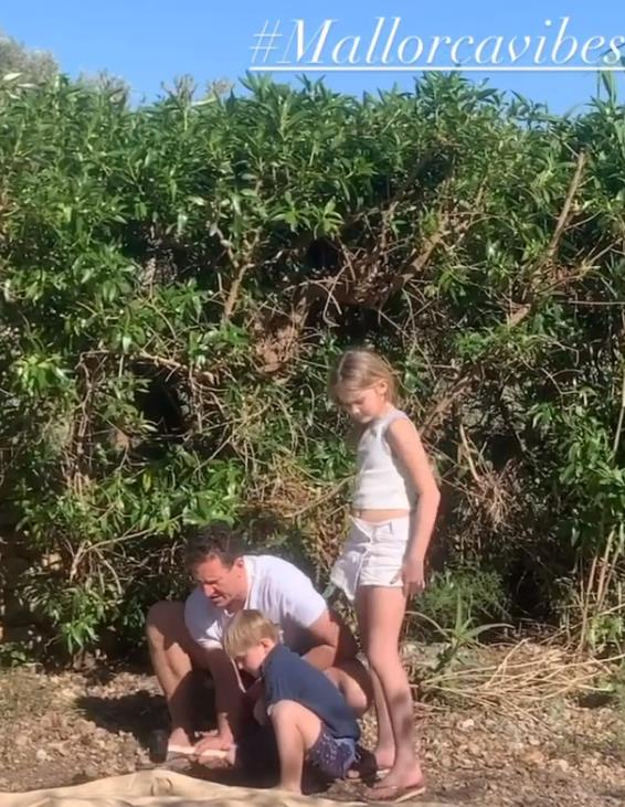 Brendan Cole builds an outdoor shower out of rocks after revealing whole family are living in a tent in Mallorca