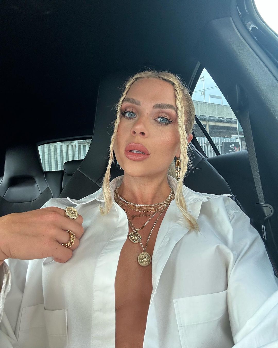 Love Island star Gabby Allen ditches her bra for very daring open shirt look