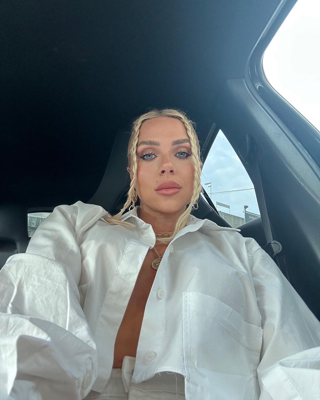 Love Island star Gabby Allen ditches her bra for very daring open shirt look