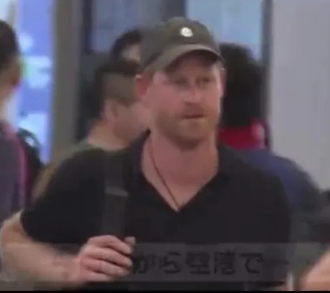 Prince Harry arrives in Japan without Meghan – and is seen proudly donning Archewell cap