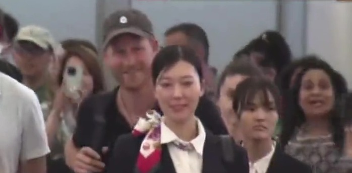 Prince Harry arrives in Japan without Meghan – and is seen proudly donning Archewell cap