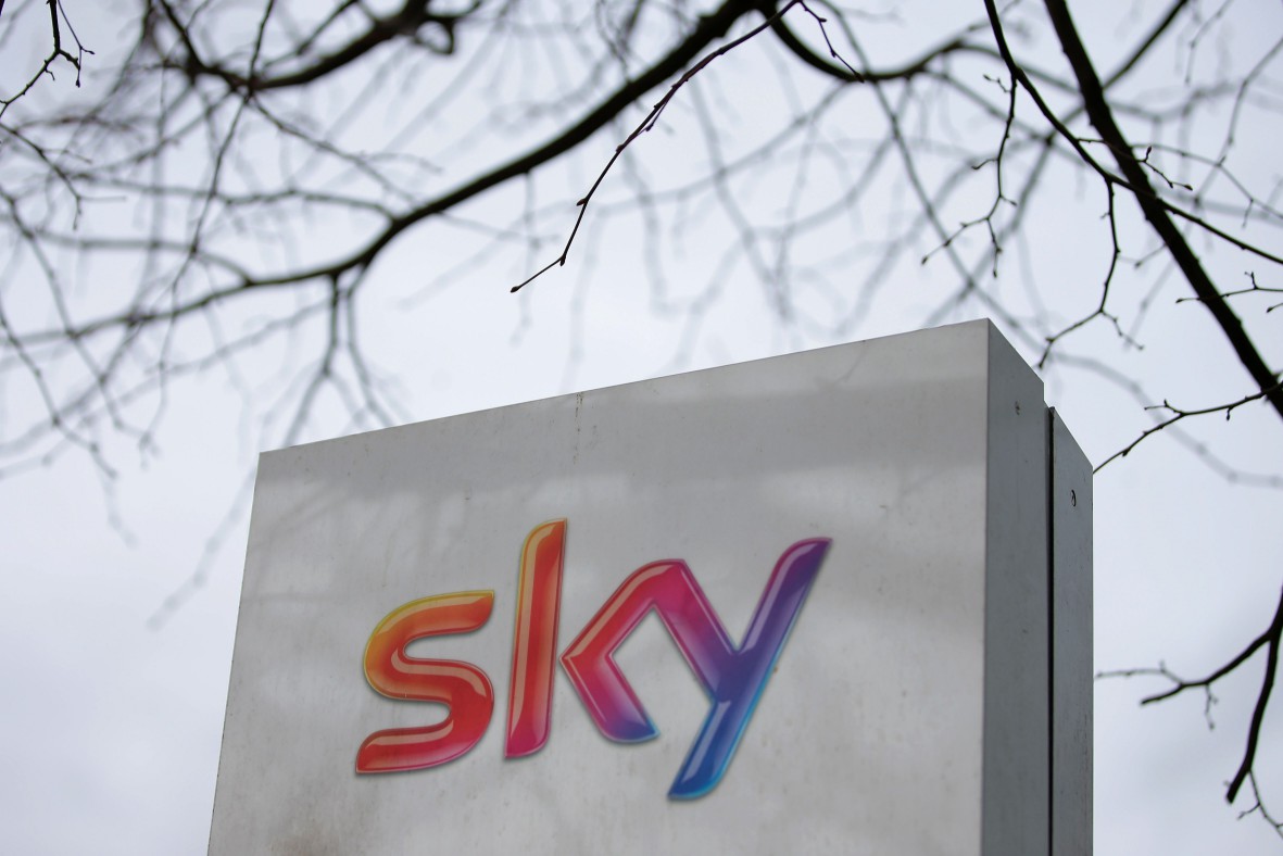 (FILES) In this file photo taken on March 17, 2017 a Sky logo is pictured on a sign next to the entrance to pay-TV giant Sky Plc's headquarters in Isleworth, west London. Rupert Murdoch's 21st Century Fox on Wednesday, July 11, 2018, revealed it had increased a takeover offer for pan-European TV group Sky, valuing the group at £24.5 billion ($32.5 billion, 27.7 billion euros) and trumping Comcast's rival offer. / AFP PHOTO / Daniel LEAL-OLIVASDANIEL LEAL-OLIVAS/AFP/Getty Images