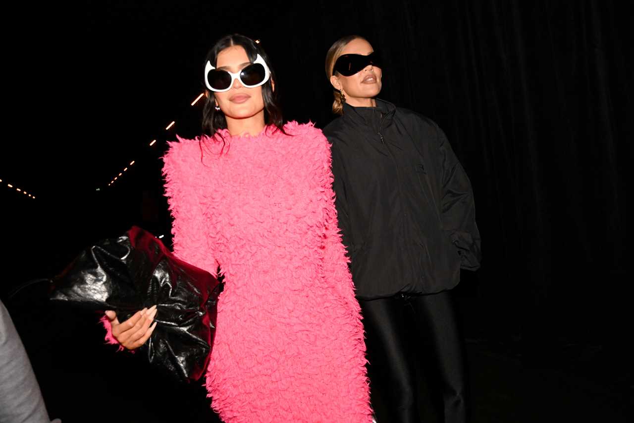 VILLEPINTE, FRANCE - OCTOBER 02: Kylie Jenner and Khloé Kardashian attend the Balenciaga Womenswear Spring/Summer 2023 show as part of Paris Fashion Week on October 02, 2022 in Villepinte, France. (Photo by Anthony Ghnassia/Getty Images For Balenciaga)