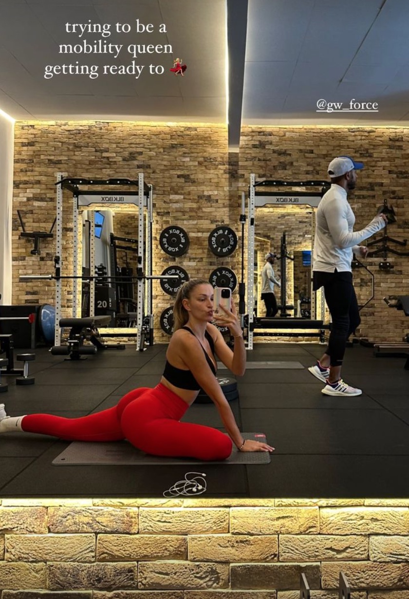 Strictly’s Zara McDermott shows off her toned bum in very tight gym gear as she stretches during training