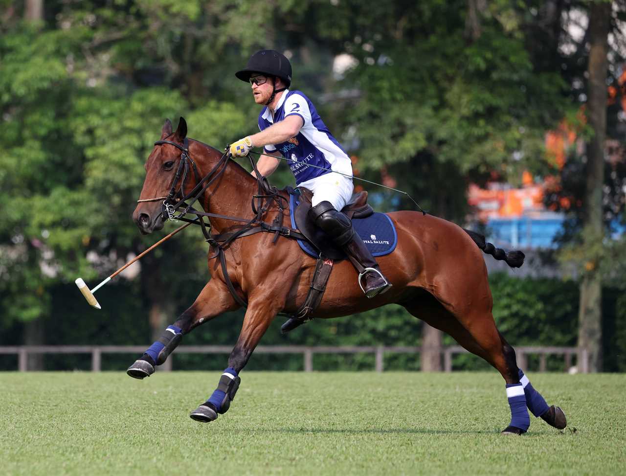 epa10796347 Prince Harry, The Duke of Sussex, in action at the 2023 Sentebale ISPS Handa Polo Cup charity polo match, at the Singapore Polo Club in Singapore, 12 August 2023. EPA/HOW HWEE YOUNG