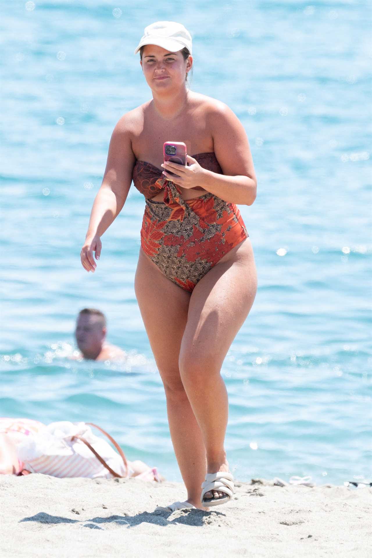 EastEnders legend Jacqueline Jossa relaxes with family as she hits the beach in swimsuit